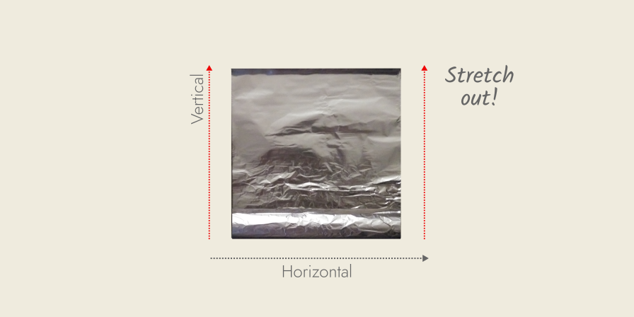 aluminum foil stretched out to form a square sheet of foil